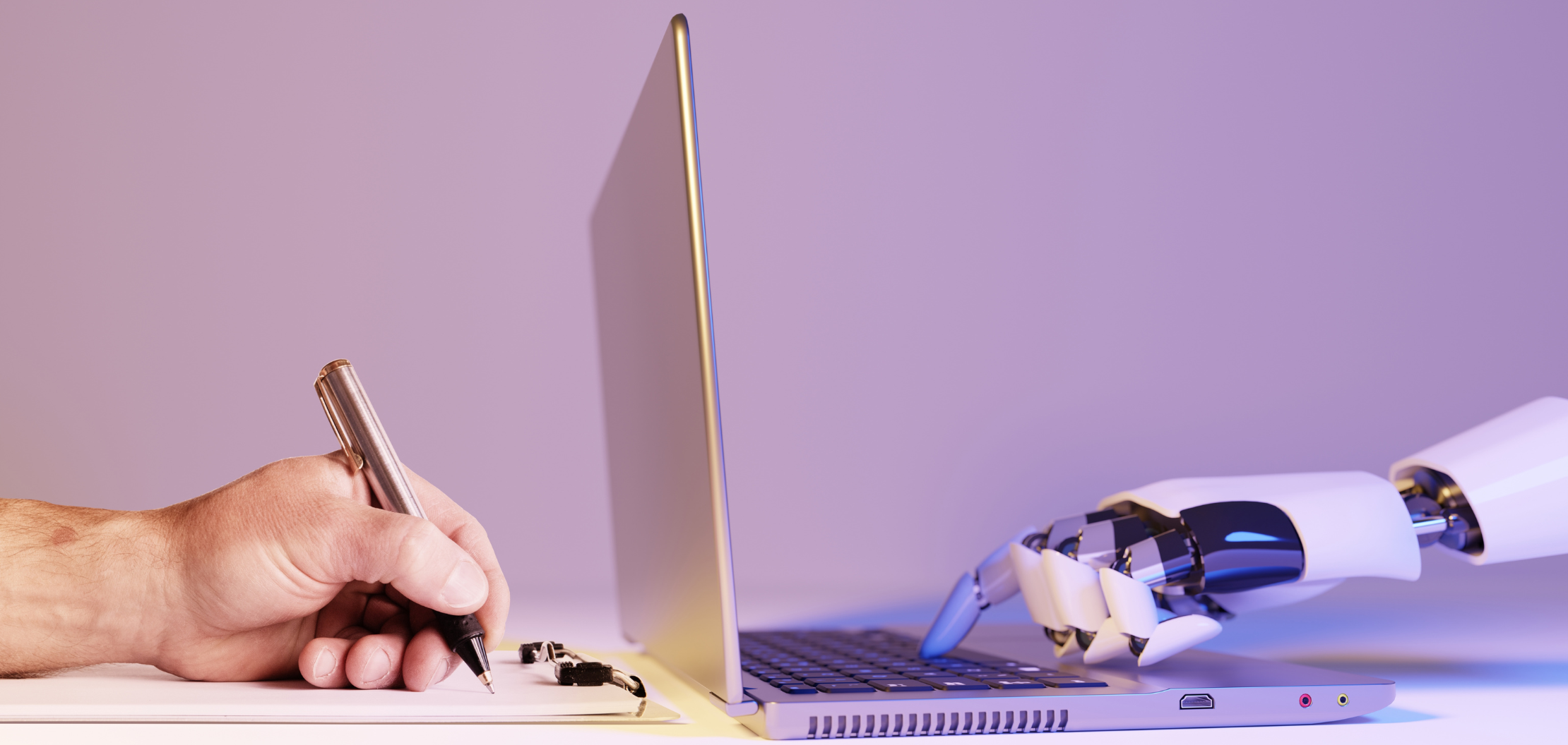 A human holding a pen and writing on a notepad whilst on the opposite side a robot hand is pressing letters on the keyboard