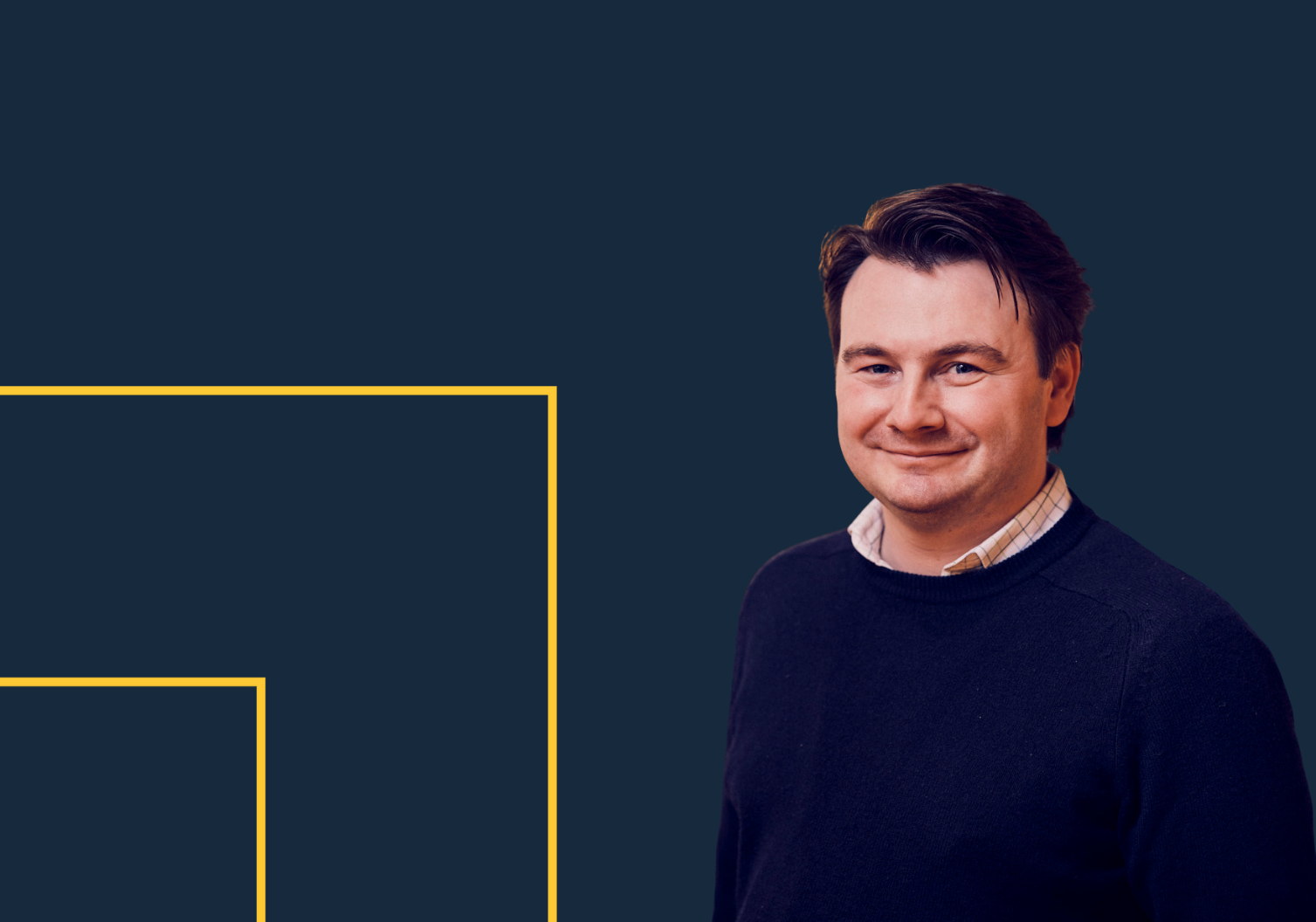 Henry Rubinstein, Head of Construction PR at The Think Tank, against a blue backdrop with a yellow logo