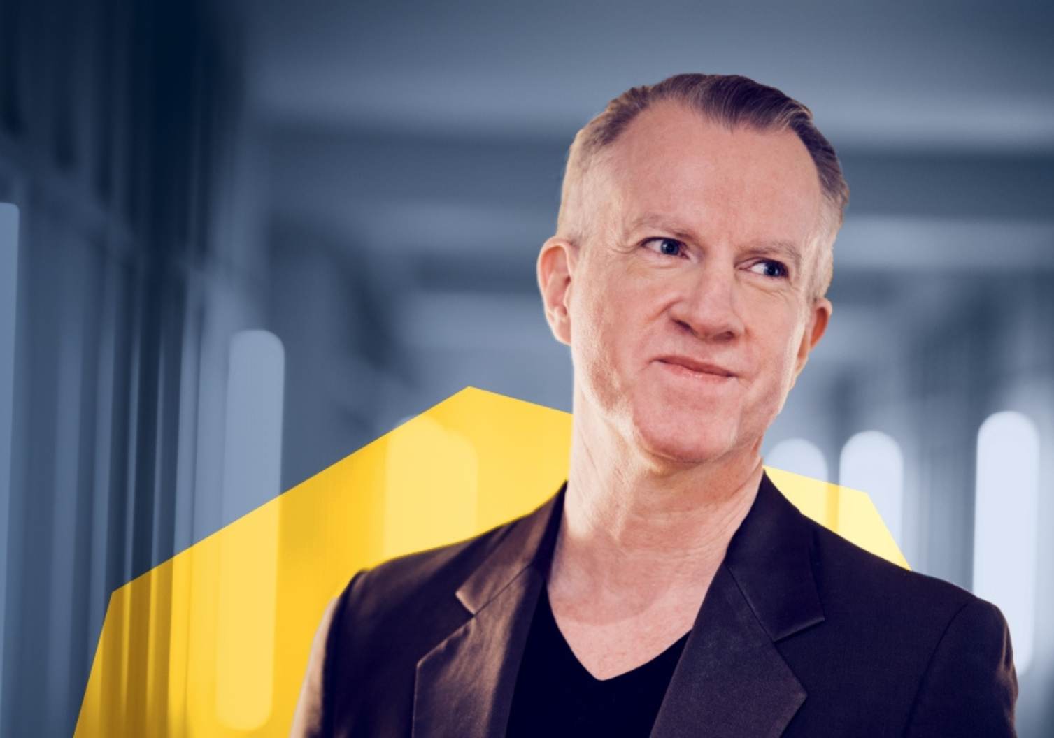 Think Tank's Senior Copywriter Jesper in a suit, for his latest AI article in Think Tank's brand blue and yellow image treatment.