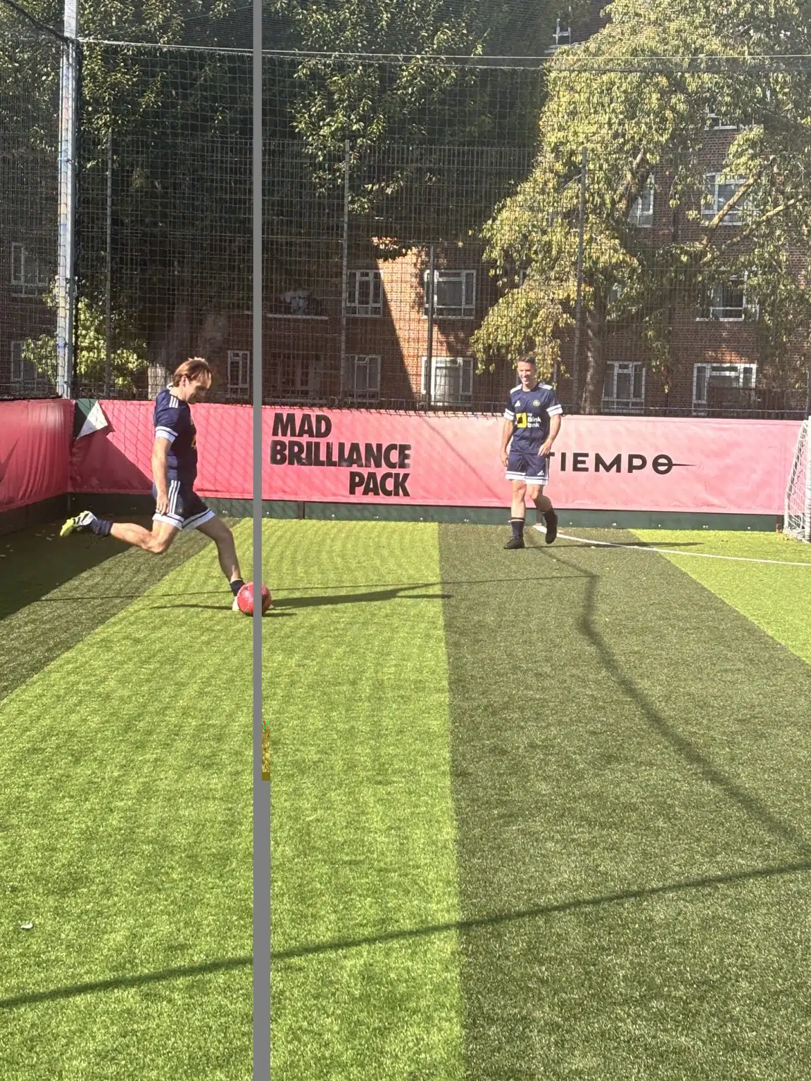 Tobias kicking football